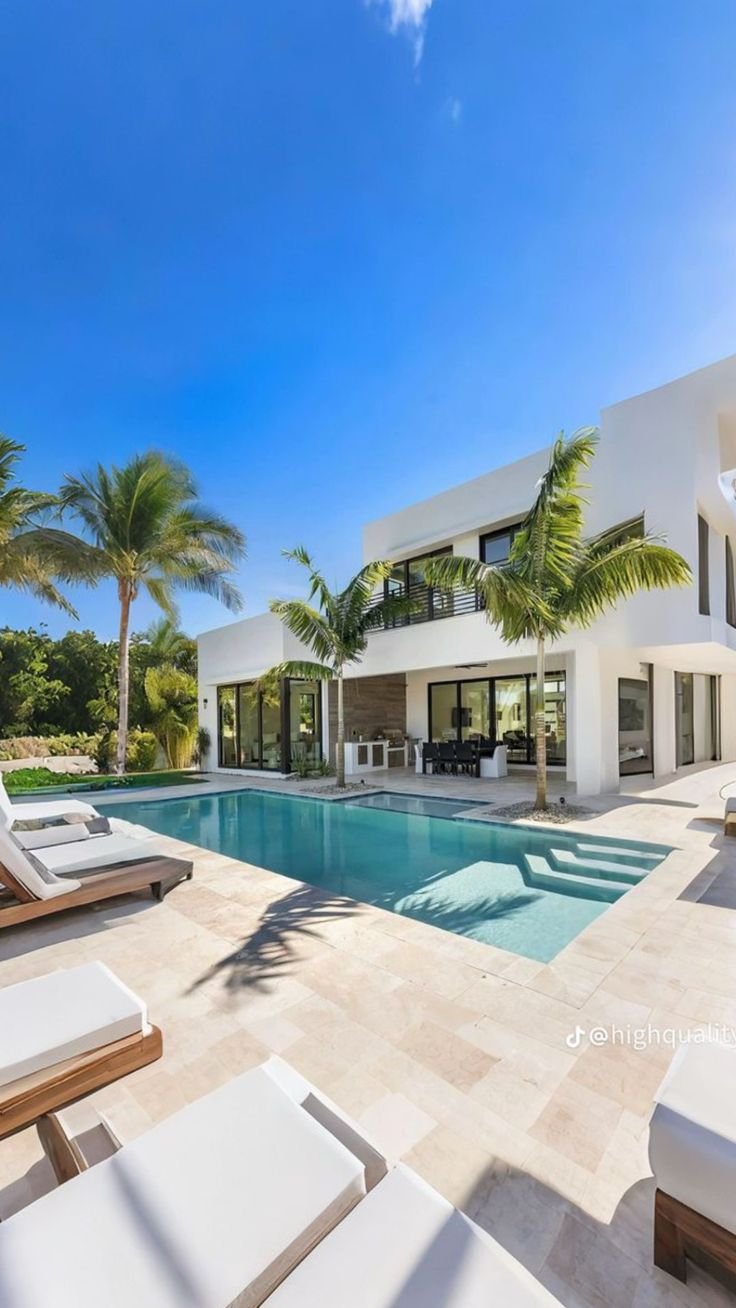 Sun loungers arranged on a villa pool terrace